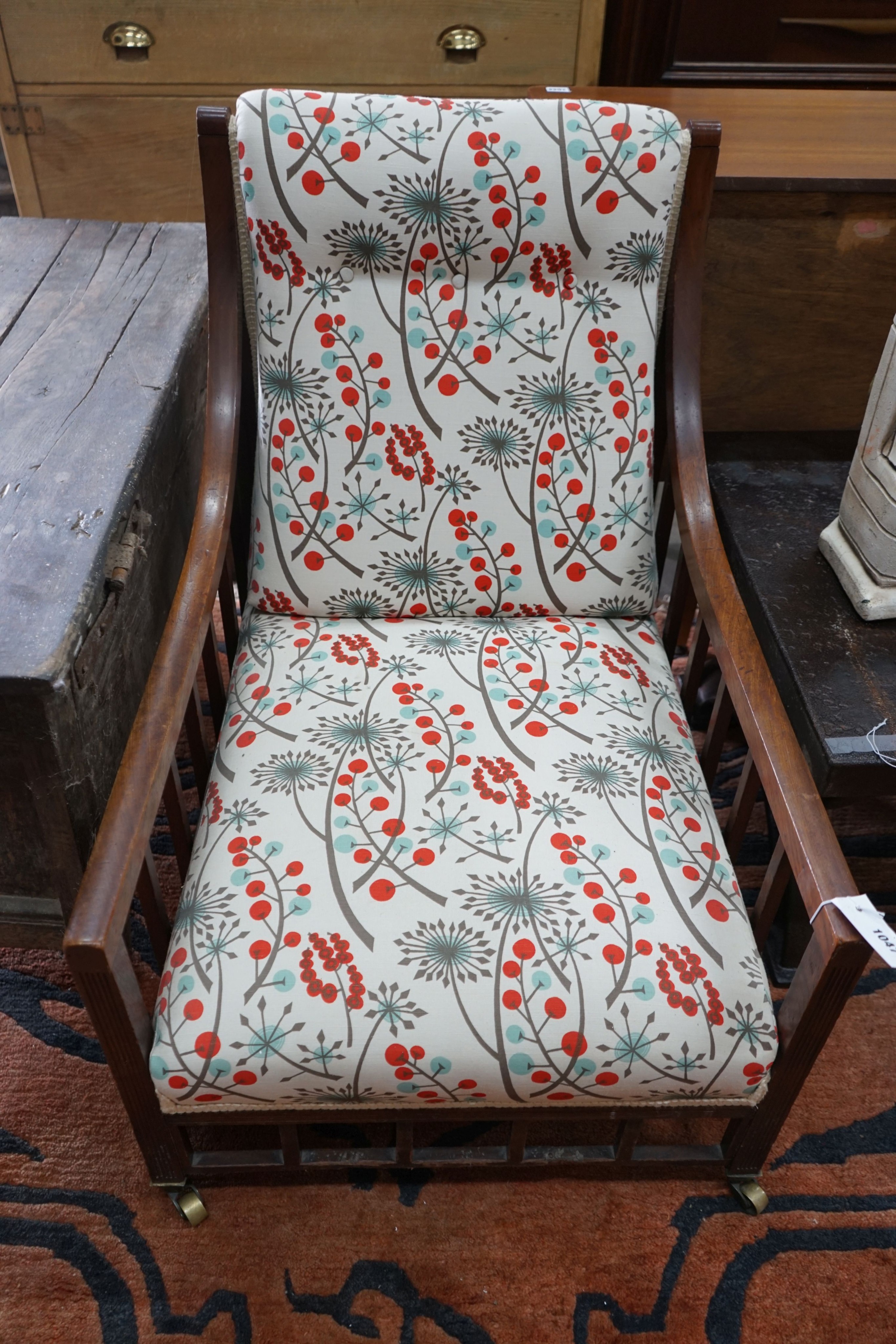 An Arts and Crafts mahogany armchair, recently re-upholstered, width 60cm, depth 82cm, height 82cm